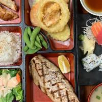 Deluxe Bento H · Grilled mackerel served with ponzu sauce. Comes with miso soup, salad, white steam rice, 2pc...