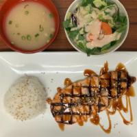 Salmon Teriyaki · Grilled salmon in a teriyaki sauce. Comes with miso soup, green salad and whit steam rice