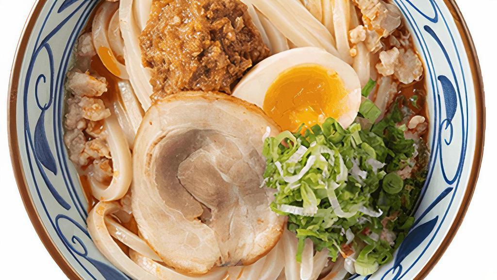Tonkotsu · Made-to-order Udon noodles served in a pork broth with chashu pork, miso ground pork, garlic, seasoned egg, and chili oil.