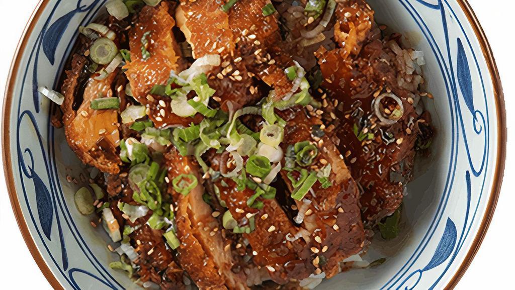 Chicken Teriyaki Bowl · House-made sweet soy glaze on our big chicken katsu, served with your choice of steamed rice or udon noodles, topped with chopped scallions and toasted sesame seeds