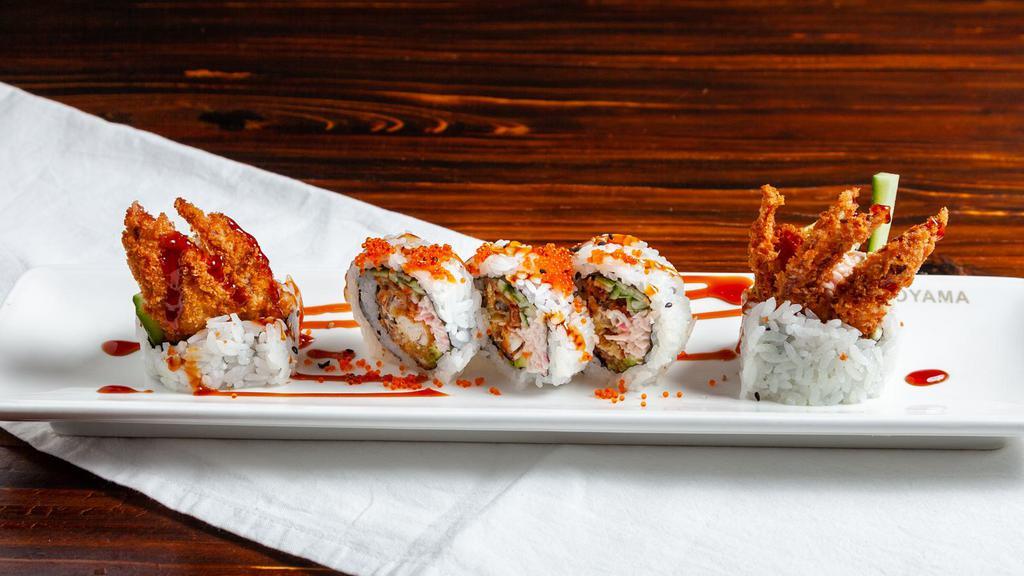 18. Spider Roll  · Deep-Fried Soft Shell Crab, Crab Meat, Avocado, Cucumber Topped W/ Tobiko & Unagi Sauce.