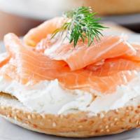 Smoked Salmon Bagel · Cream cheese, smoked salmon, tomato, and red onion, served on everything bagel.