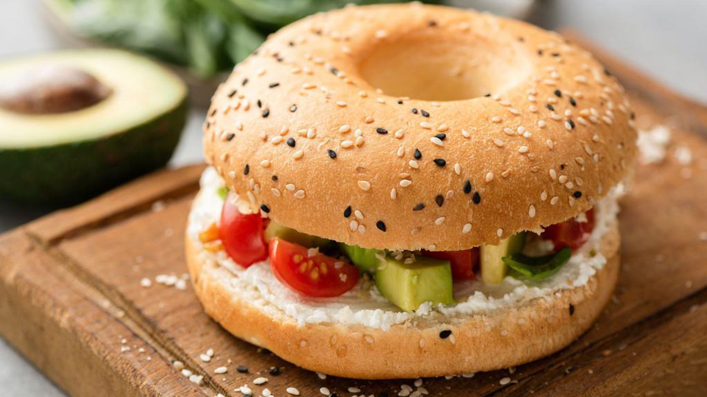 Avocado Bagel Breakfast · Vegetarian. Sliced Avocado, cream cheese and tomato, served on a toasted bagel.