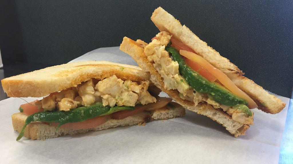 Santa Fe Chicken · Grilled chicken, melted jack, avocado, tomato and chipotle mayo on sliced sourdough toast.