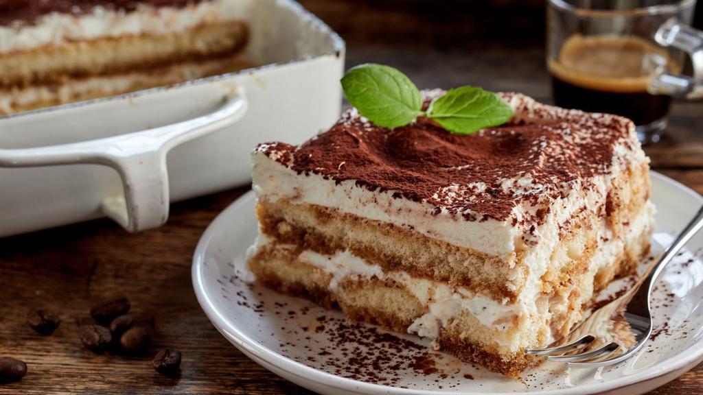 Tiramisu · Light dessert made with ladyfingers dipped in coffee layers of fluffy mascarpone cheese and a hint of cocoa.