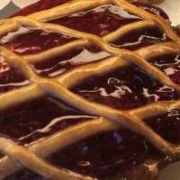 Linzer Tart · Raspberry jam and almond cream.