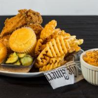 The Flock (4 Pieces Meal) · Four piece of fried chicken, two cornbread muffins, pickles, and your choice of two sides.