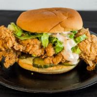 Fried Chicken Sandwich · Fried chicken thigh, potato bun, shredded lettuce, and house sauce. Allergens: (Gluten, Alli...