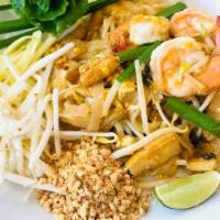 Pad Thai · Stir-fried thin noodles with egg, bean sprouts, carrots, green onions, peanut in tamarind sa...
