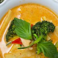 Red Curry · Zucchini, broccoli, bell peppers, bamboo shoots and basil. Served in coconut house red curry...