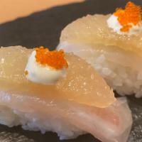 Tai Grape · (2 pieces) Red snapper sushi with grapefruit.