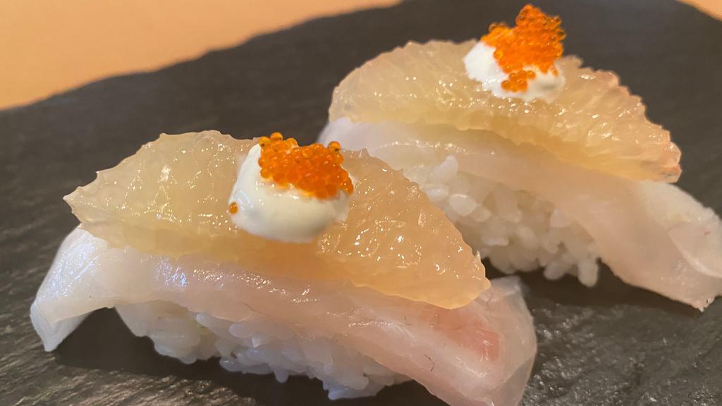 Tai Grape · (2 pieces) Red snapper sushi with grapefruit.