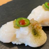 Spicy Scallop · (2 pieces) Scallop sushi with hot salsa sauce.