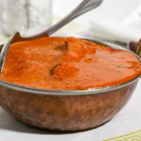 Chicken Tikka Masala · Boneless chicken tikka simmered in our signature butter cream & tomato sauce.