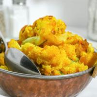 Aloo Gobhi · Potatoes and cauliflower cooked with herbs and spices