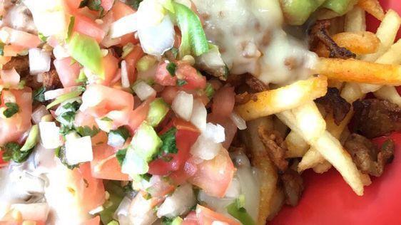 Steak & Fries · Steak on the grill and fries with guacamole, pico de gallo, cheese and sour cream.