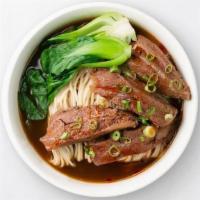 Braised Beef Noodle Soup · With house-made egg noodles and hearty flavors, our Braised Beef Soup is carefully cooked fo...