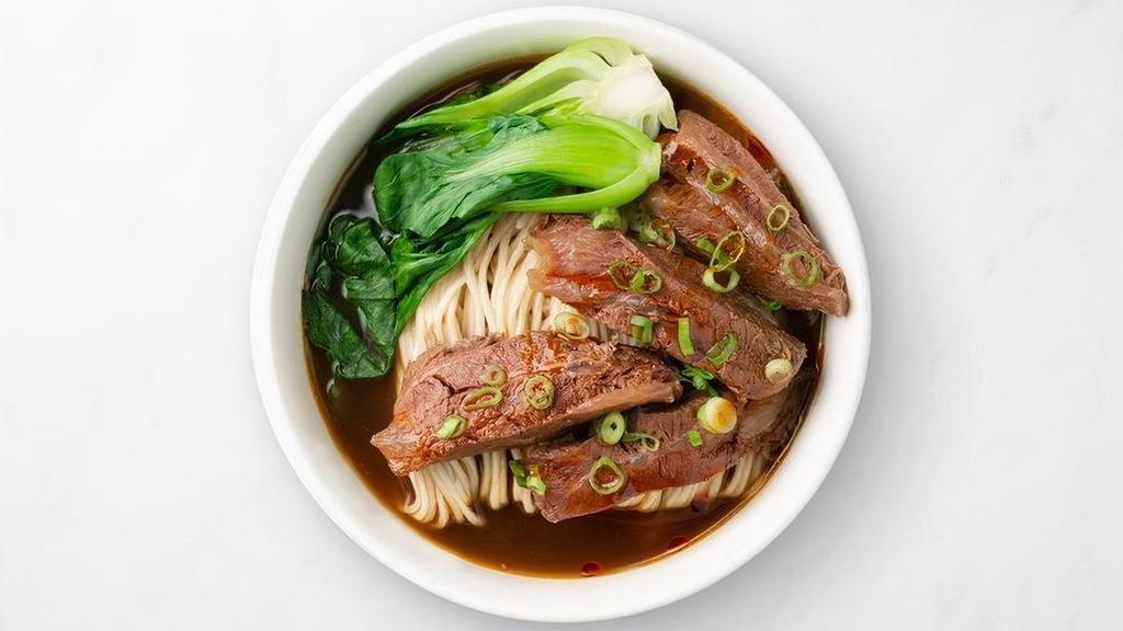 Braised Beef Noodle Soup · With house-made egg noodles and hearty flavors, our Braised Beef Soup is carefully cooked for hours to bring out its signature mildly spicy and aromatic flavors. Topped with blanched baby bok choy for a pop of color and crunch.