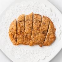 Fried Pork Chop · Each pork chop cutlet is fried to perfection and garnished with freshly ground coarse pepper...