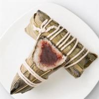 Red Bean Sticky Rice Wrap · Smooth, lightly-sweetened red bean paste enveloped in sticky rice and wrapped in bamboo leav...