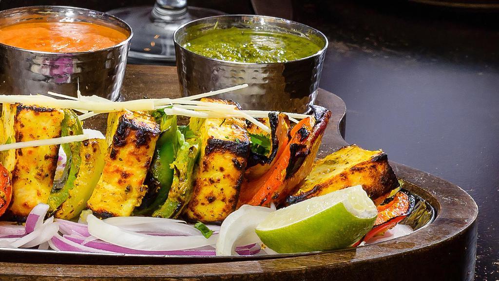 Methi Paneer Tikka · Gluten Free. 4 Cottage cheese, bell pepper, onion marinated in spices and skewered in a clay oven.