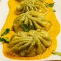 Veg Momo · Vegetarian. Famous Nepalese style steamed veggie dumpling served with tomato and sesame chut...