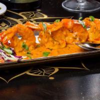 Prawn Peri Peri · Gluten Free. Tiger shrimp seasoned with hand pound chili, garlic, lime and coconut sauce.