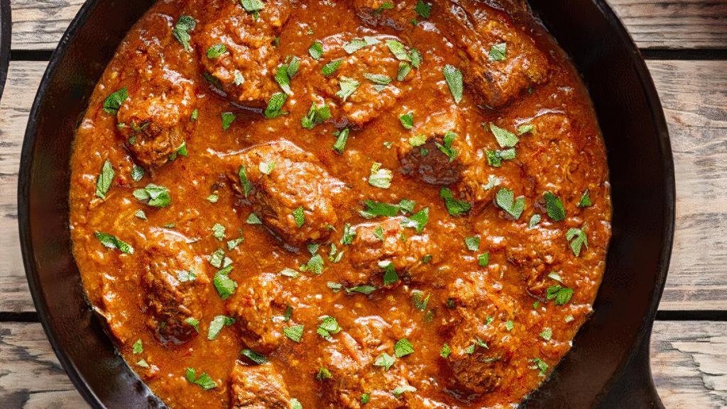 Lamb Rogan Josh · Gluten Free. Stewed Colorado lamb chunks, blend of spices, brown onion and tomatoes. (Comes with Rice)