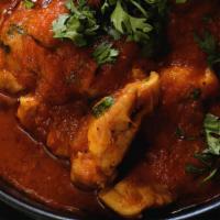 Chicken Curry · Gluten Free. Boneless chicken cooked with cumin, turmeric, ginger, garlic, onion, tomato and...