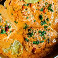 Salmon coconut curry · Gluten Free. Salmon cooked in tomato, mustard seeds, garlic, curry leaf, coconut milk and sp...