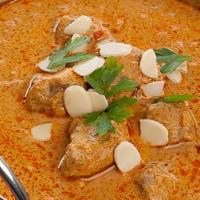 Lamb korma · Contain Nuts. Lamb chunks cooked with blend of spices,  brown onion, cream & cashew sauce. (...
