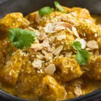 Chicken Korma · Contain Nuts.  Chicken chunks cooked with blend of spices, brown onion, cream & cashew sauce.