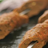 Lamb Seekh Kabab · Gluten Free. Ground lamb, ginger, mint, spices skewered in clay oven