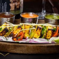 Paneer Tikka · Gluten Free. Cottage cheese marinated in hung yogurt and spices skewered in clay oven.