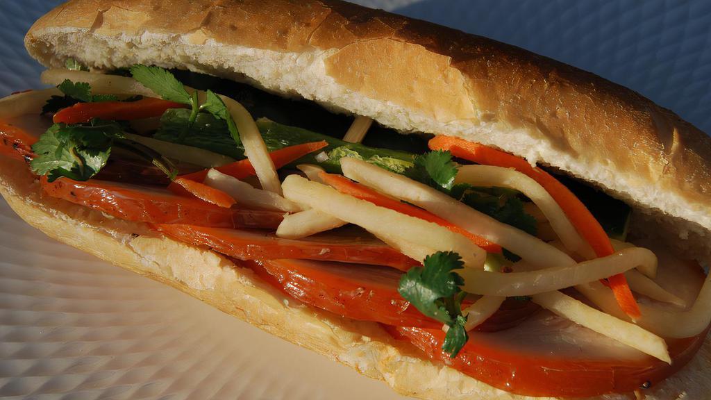 Pork Belly Banh Mi · Baked pork belly with five spices & pate
carrot & daikon pickles, cucumber, cilantro & jalapeños