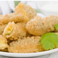 FP's Jalapeno Poppers · jalapenos filled with cream cheese, breaded and deep fried, served with side of ranch.