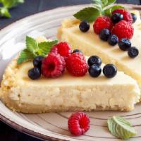 FP's Homemade cheesecake · A slice of creamy cheesecake with fruit topping