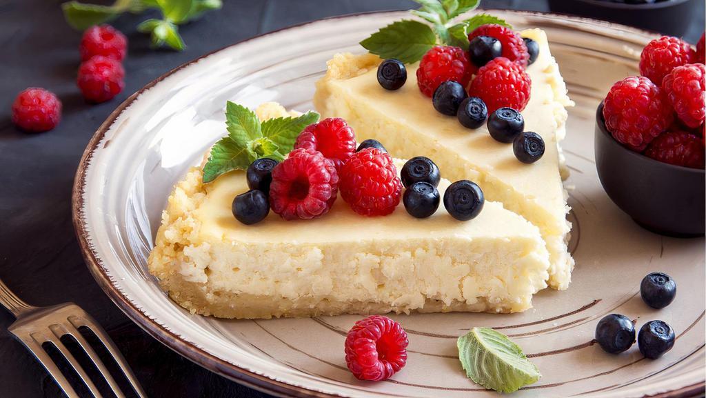 FP's Homemade cheesecake · A slice of creamy cheesecake with fruit topping