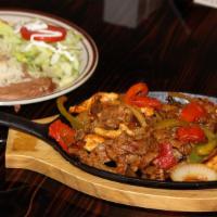 Fajitas · Chicken, steak, shrimp, or mix for additional charge.