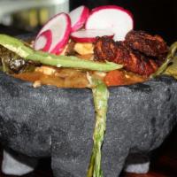 Molcajete · Steak, shrimp and chicken, onions, tomato, mushrooms and grilled cactus.