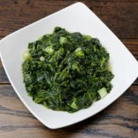 Sabzi · Cooked spinach with herbs and spices.