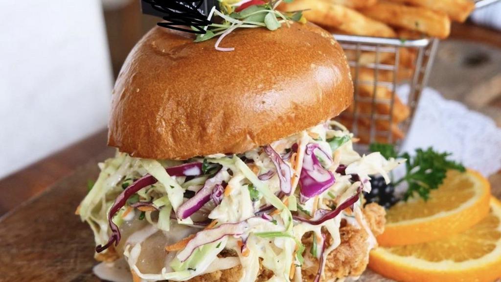 Fried Chicken Sandwich · Home fried chicken, lettuce, tomatoes, red onion, white cheddar cheese, sambal mayo. served with French fried and salad.