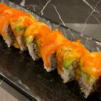 Ryan · Deep fried shrimp tempura, imitation crab topped with salmon, avocado & fish egg. Sauce - un...