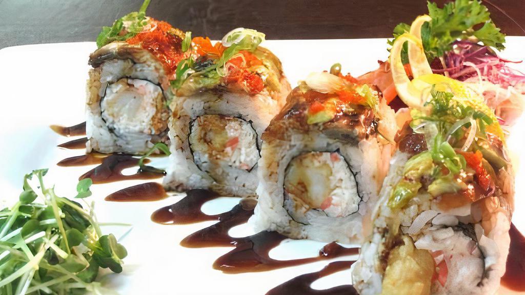 Oakland · Shrimp tempura, imitation crab, fish egg topped with unagi, avocado. Sauce - unagi sauce.