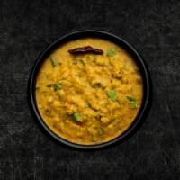 Daal Yellow Mellow · Yellow lentils, slow-cooked to perfection and tempered with cumin, garlic, and chilies.
