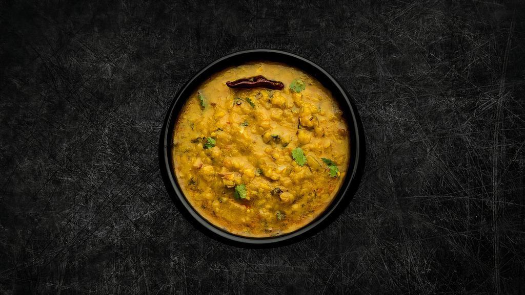 Daal Yellow Mellow · Yellow lentils, slow-cooked to perfection and tempered with cumin, garlic, and chilies.