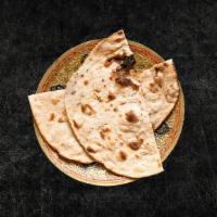 Tandoori Roti  · Whole wheat flat bread baked to perfection in an Indian clay oven.