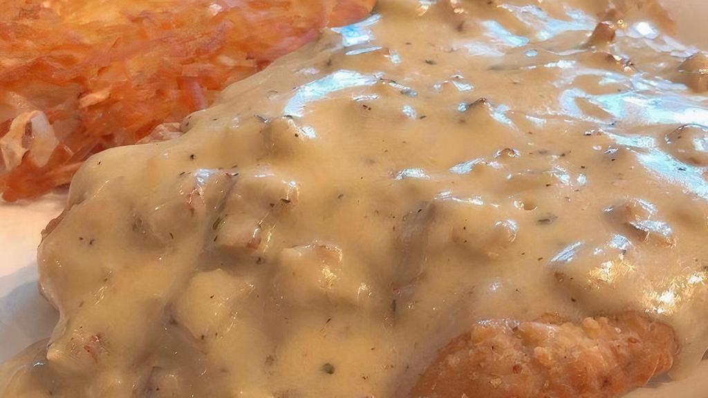 Country Fried Steak & Sausage Gravy · Country Fried Steak Smothered with Sausage Gravy, Served with 2 Eggs Any Style, Choice of Potatoes & Toast