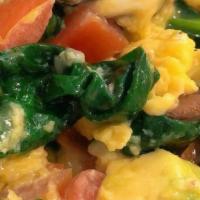 Veggie Scramble · 3 Eggs Scrambled with Spinach, Tomatoes, Mushrooms, Avocado, and Goat Cheese; Served with Ch...