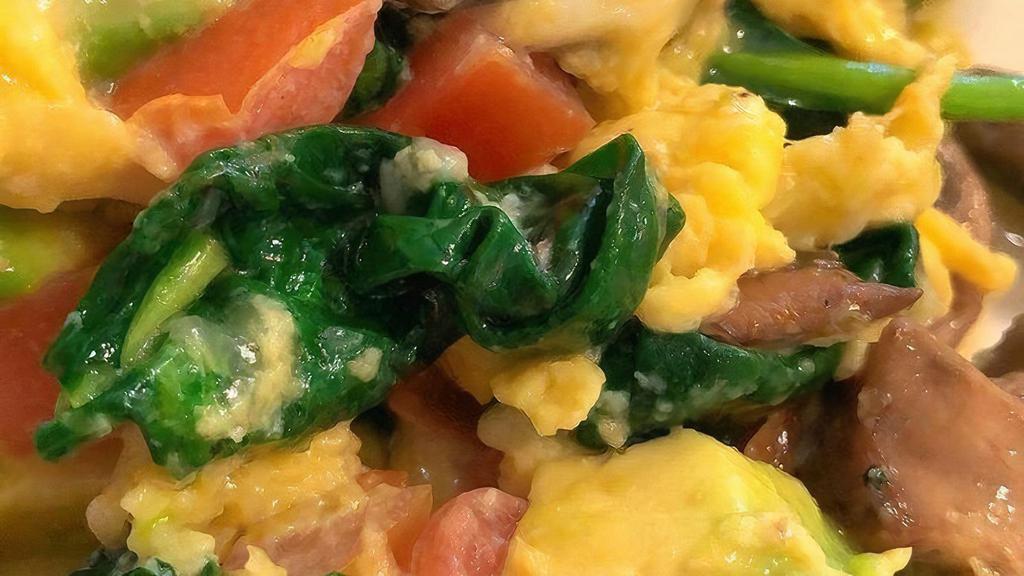 Veggie Scramble · 3 Eggs Scrambled with Spinach, Tomatoes, Mushrooms, Avocado, and Goat Cheese; Served with Choice of Potato and Choice of Toast
